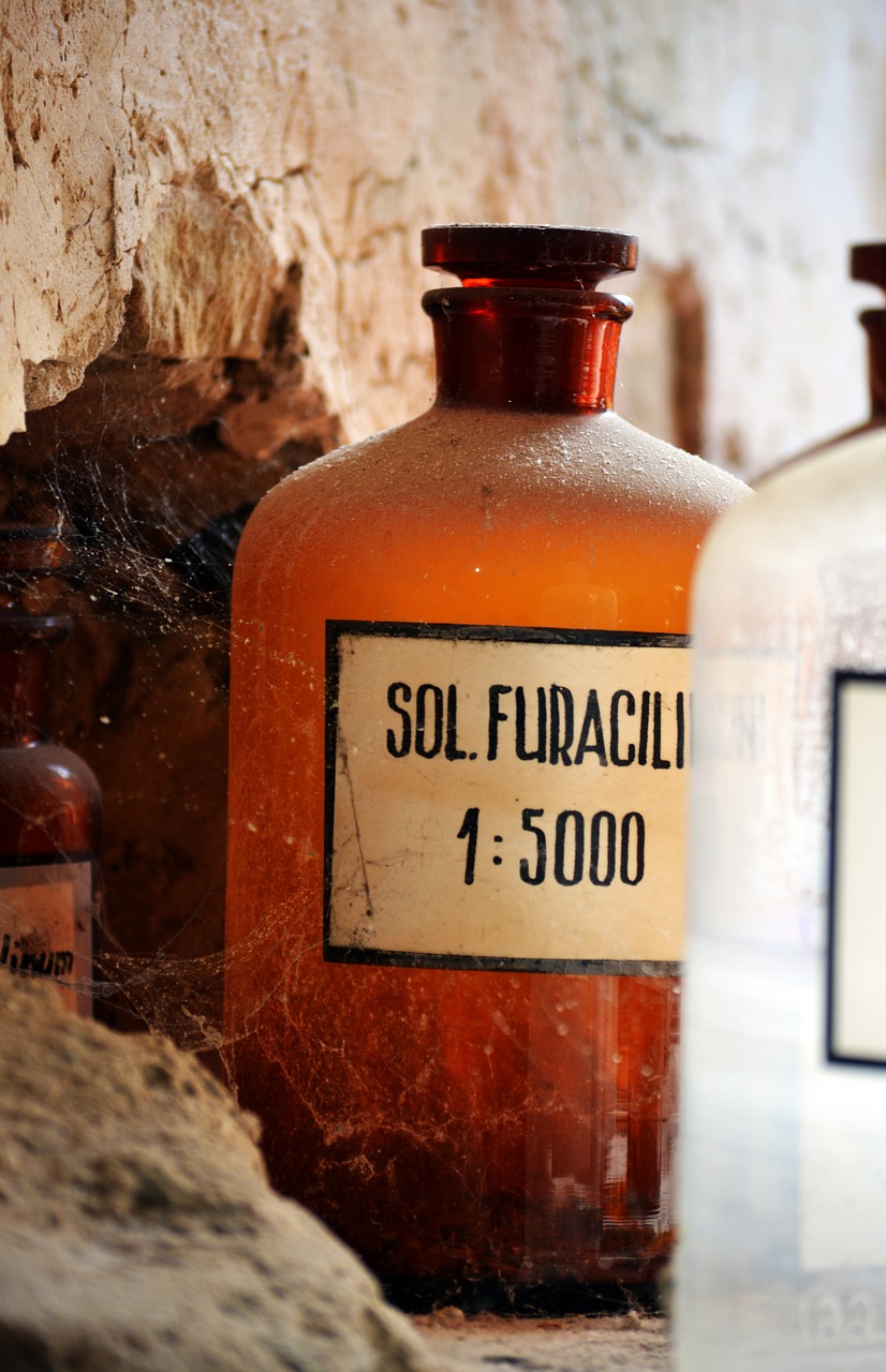 old apothecary glass bottles in warm light